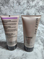Two skincare products from Mary Kay on a marble surface