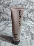 Mary Kay skincare product tube on a marble surface