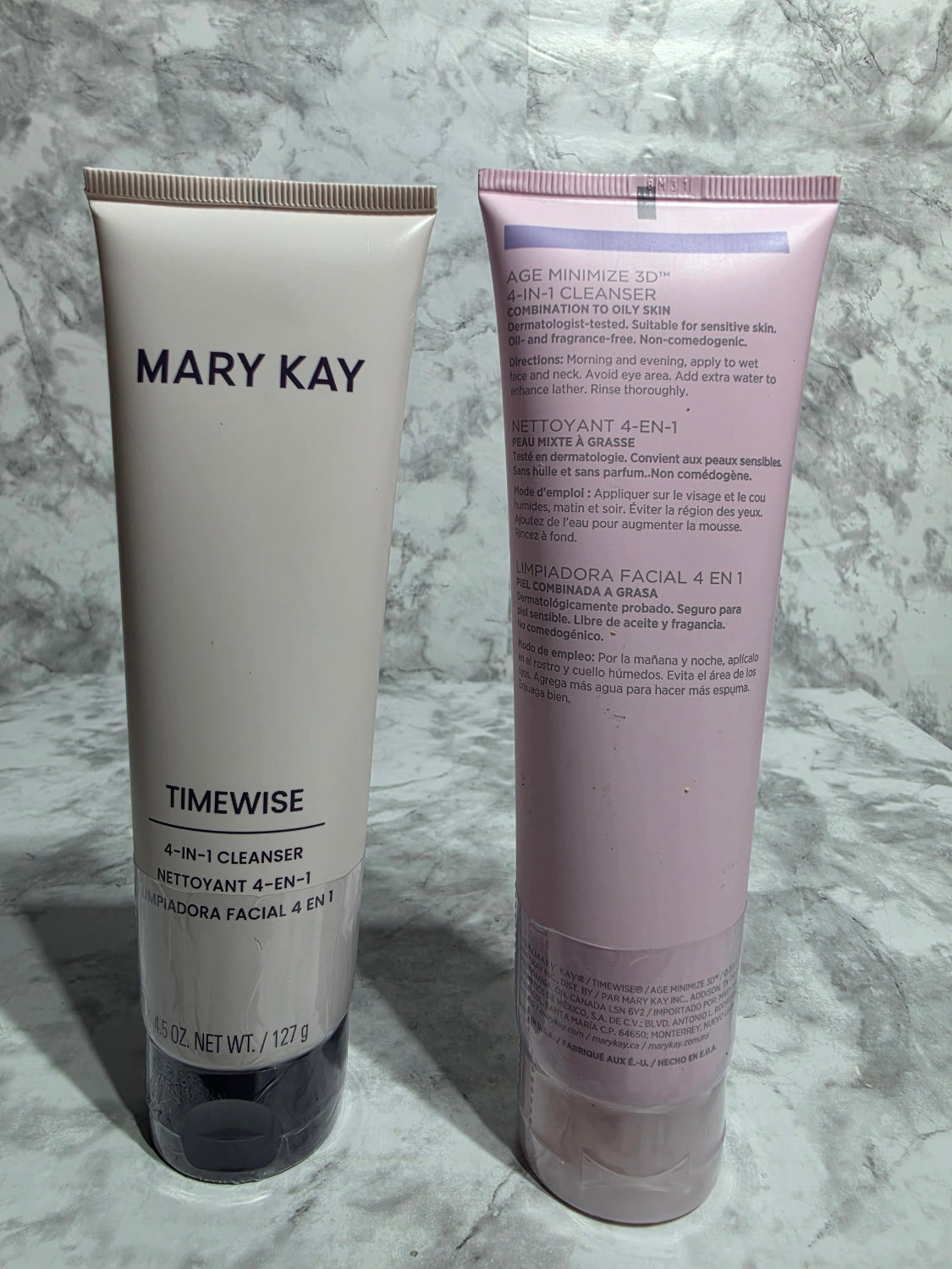 Two Mary Kay TimeWise skincare products on a marble surface