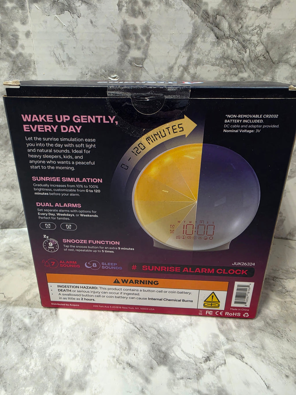 Sunrise alarm clock packaging on a marble surface