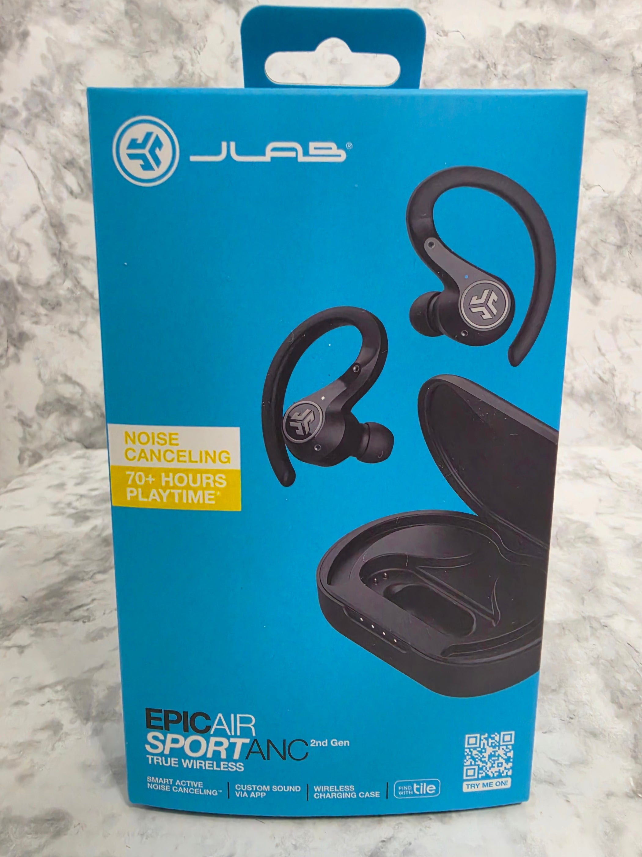 JLab Epic Air Sport ANC wireless earbuds packaging on a marble surface