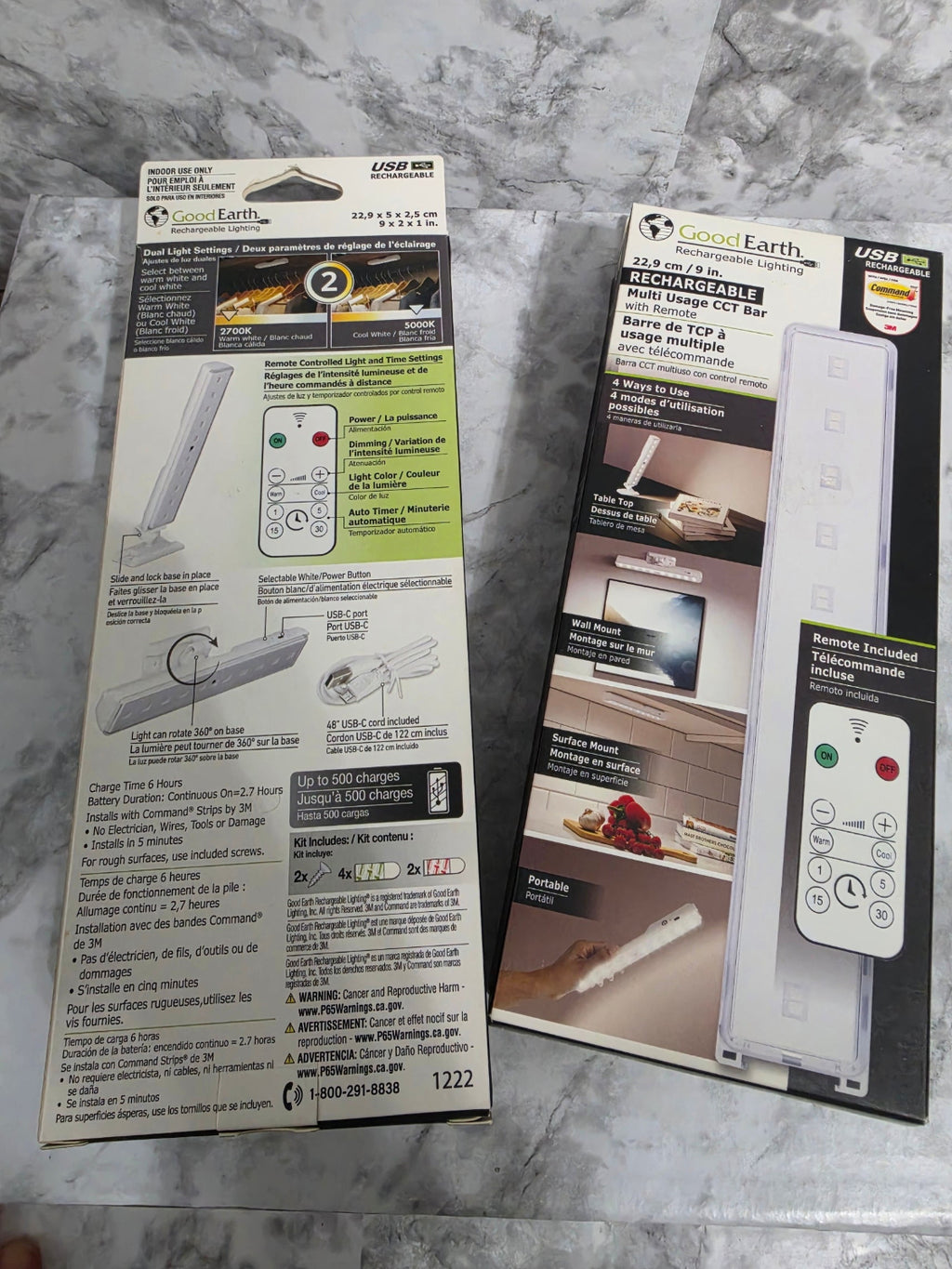 Two packages of a ceiling light fixture on a marble surface