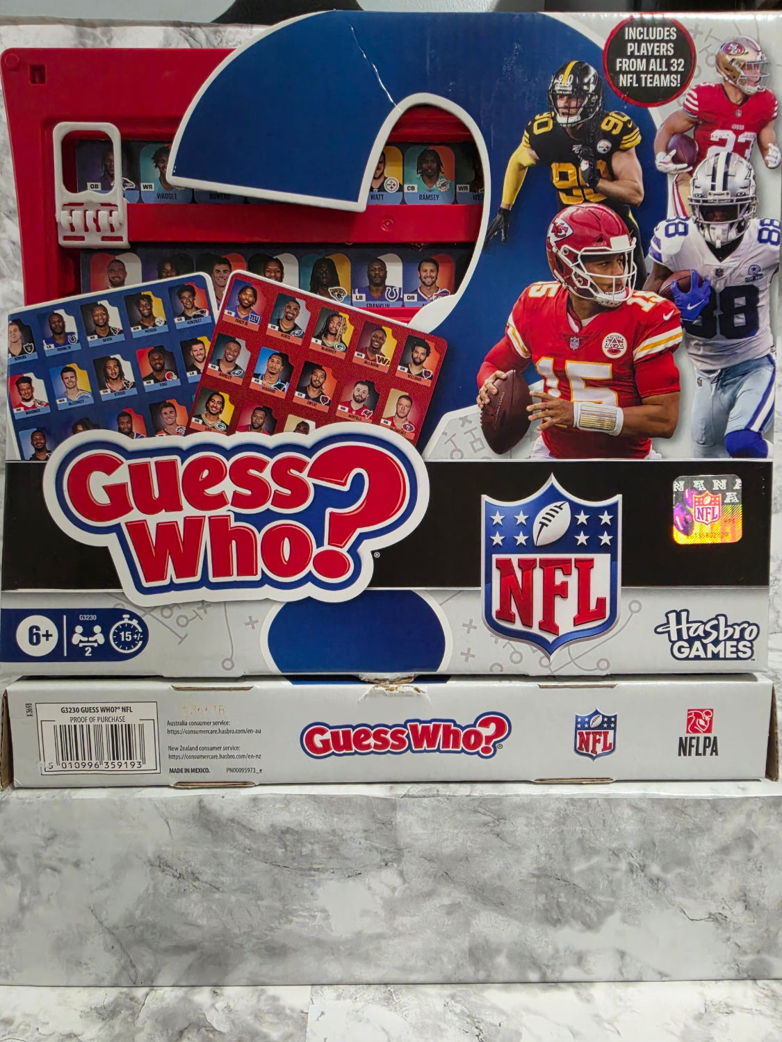 Guess Who? board game box with NFL branding on a marble surface