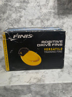 Box of FINIS Positive Drive Fins on a gray marble surface