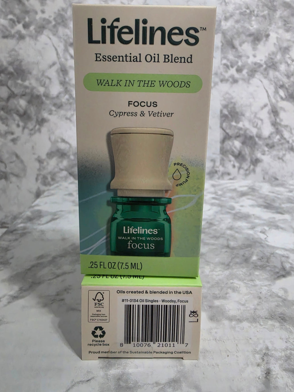Lifelines essential oil blend packaging on a marble surface