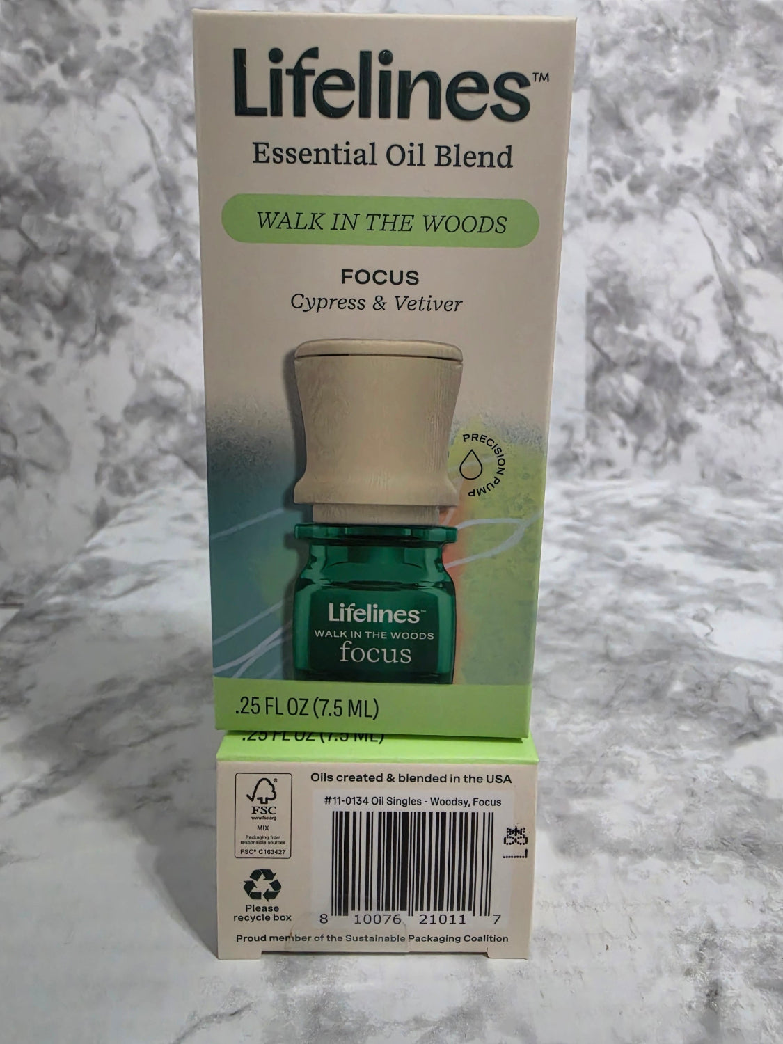 Lifelines essential oil blend packaging on a marble surface