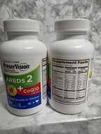 Actual product photograph of two PreserVision AREDS 2 + CoQ10 inventory bottles showing front and rear labels; this listing includes one 80-softgel bottle.