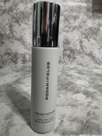 Skincare product with 'Rodan + Fields' branding on a marble surface
