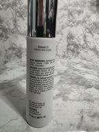 Cosmetic tube with silver cap on a marble surface