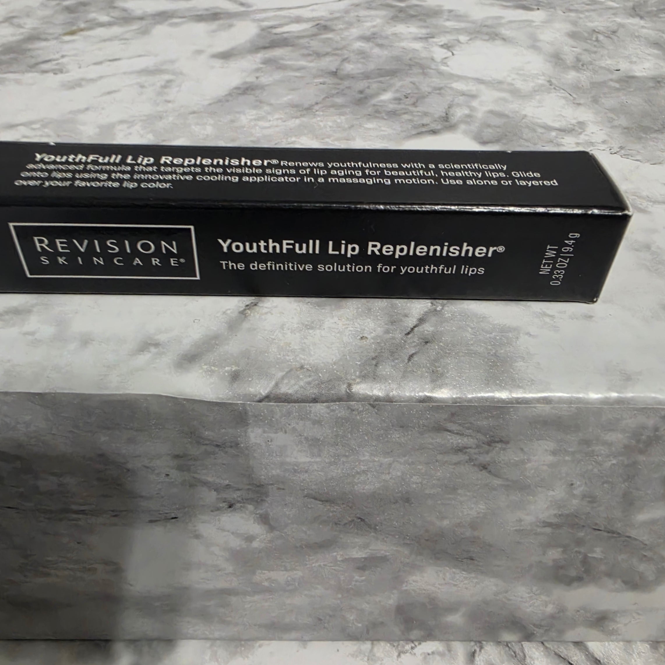 Revision Skincare YouthFull Lip Replenisher 0.33 oz 9.4g – original black box showing product name and net weight label