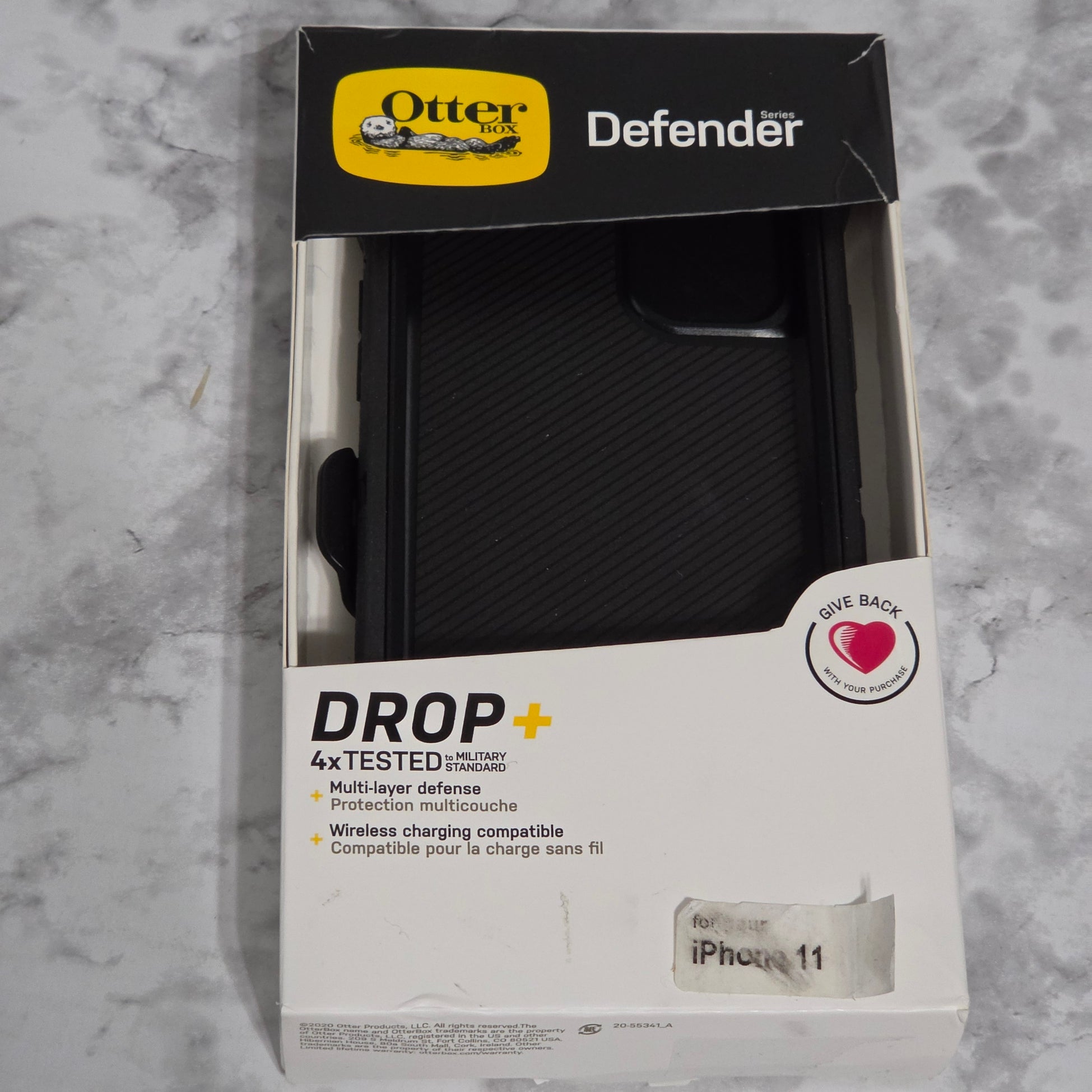 OtterBox Defender Series Rugged Case for iPhone 11 – real product retail packaging showing DROP+ 4x Military Standard and multi-layer defense