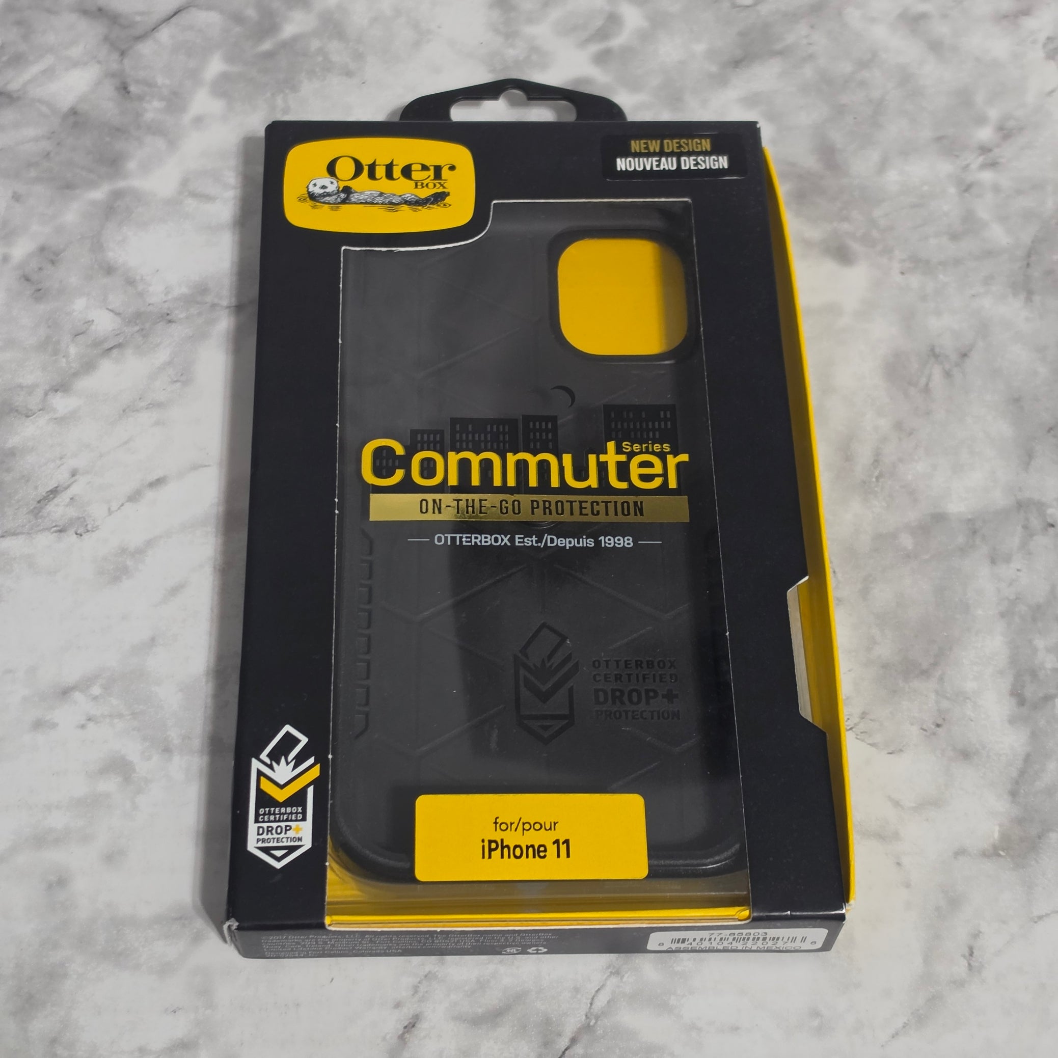 OtterBox Commuter Series Case for iPhone 11 – real product retail packaging showing Commuter Series branding, Drop+ Protection badge, and iPhone 11 compatibility