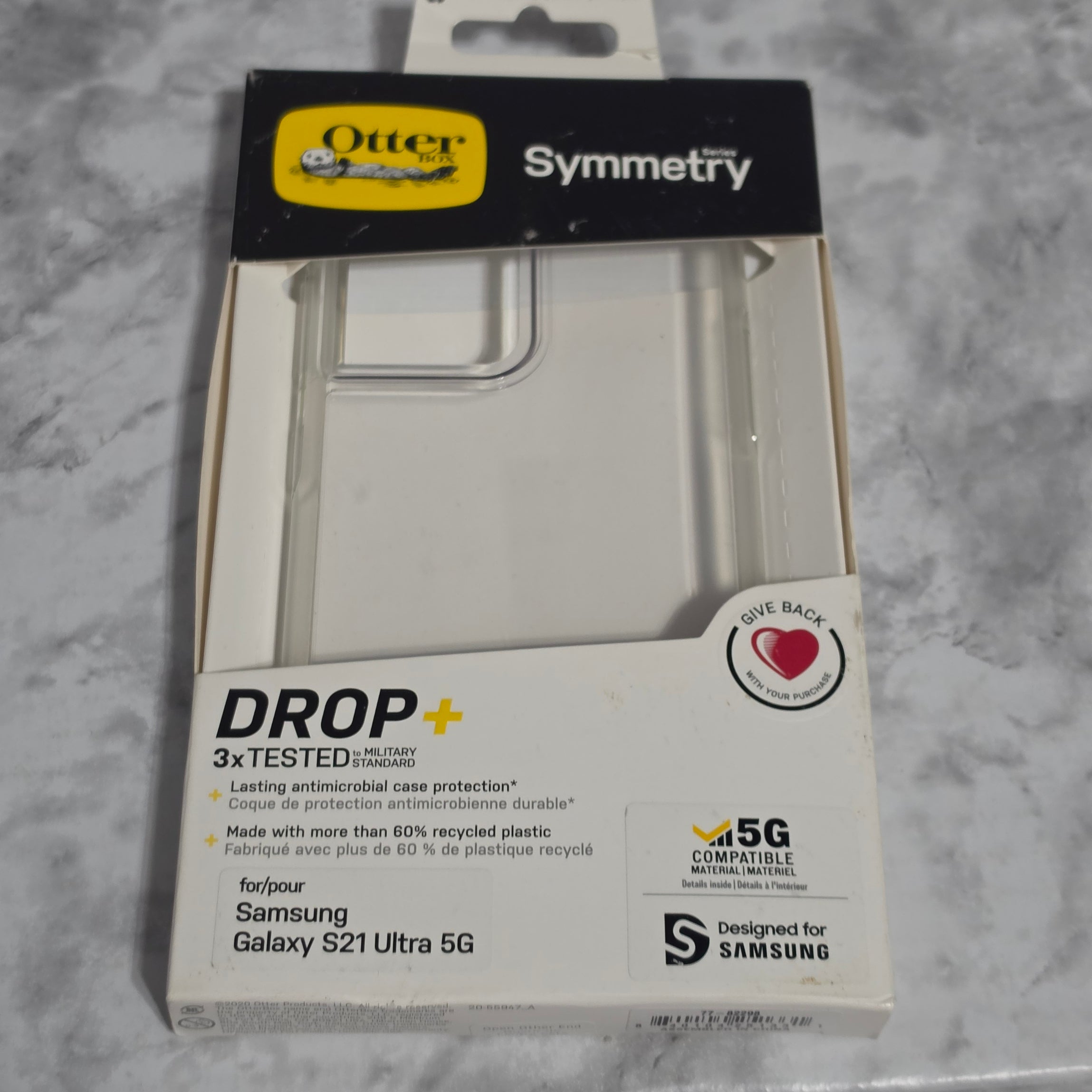 OtterBox Symmetry Series Clear case for Samsung Galaxy S21 Ultra 5G – new in original retail box showing DROP+ military standard, antimicrobial protection, 60% recycled plastic, and Designed for Samsung certification