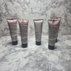 Mary Kay TimeWise Luminous-Wear Liquid Foundation tubes showing multiple shades including Ivory 3, Ivory 7, and Bronze variants on marble surface