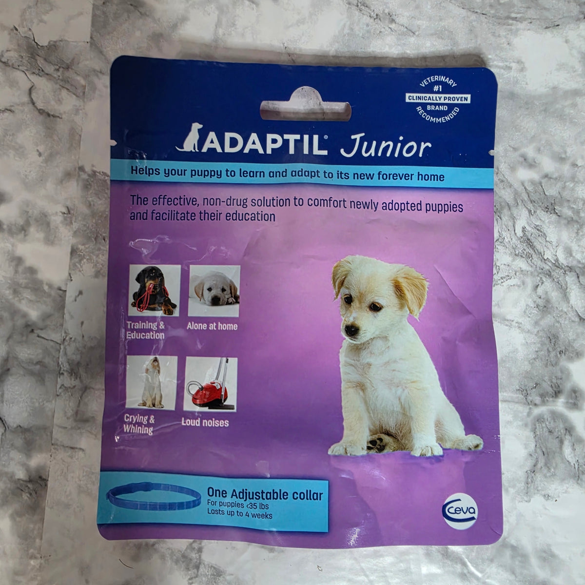 ADAPTIL Junior puppy calming collar in original blue and purple retail packaging by Ceva