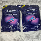 Two sealed DenTek Sensitive Gums Comfort Clean 150-count floss pick bags