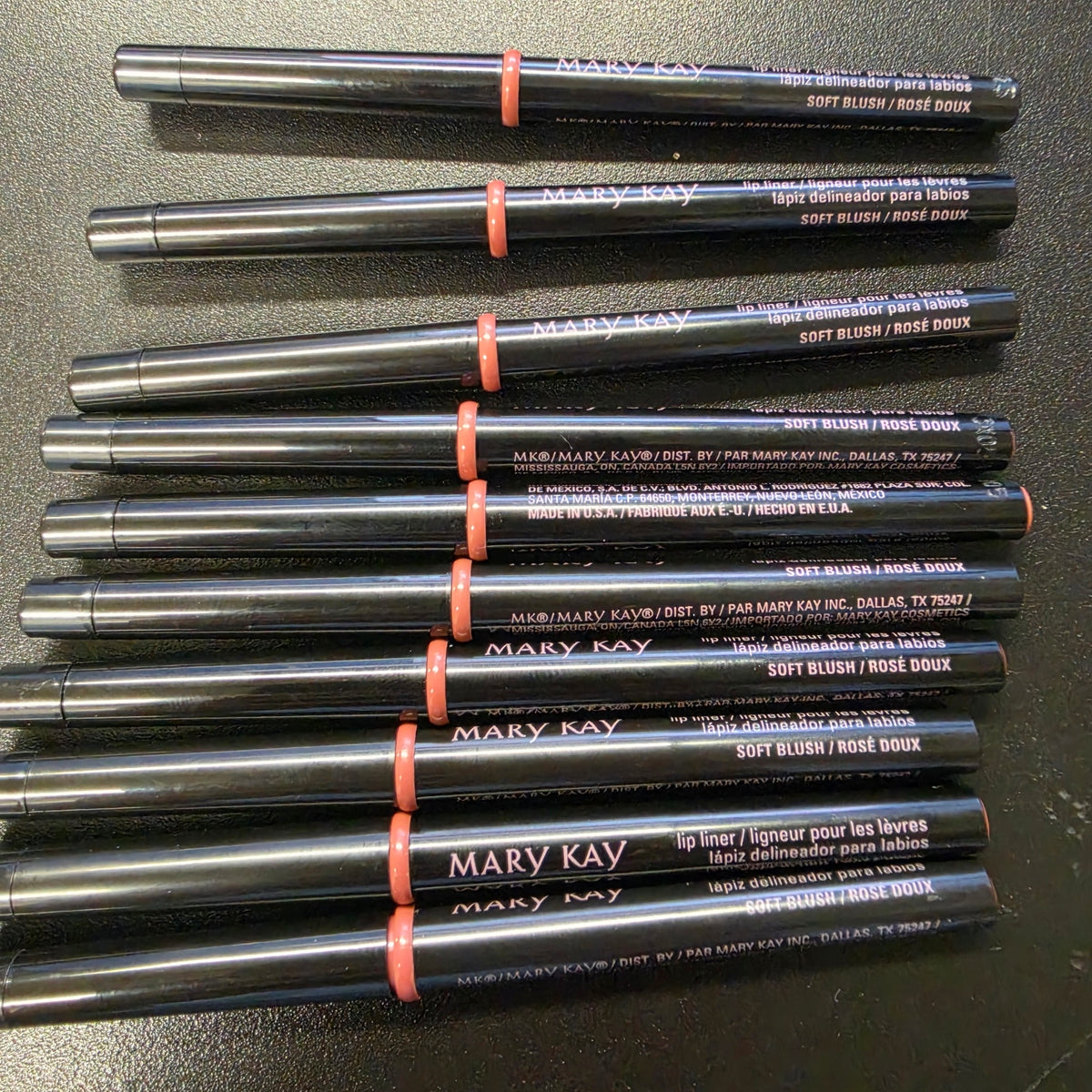 Mary Kay Soft Blush lip liners with black barrels, front view.