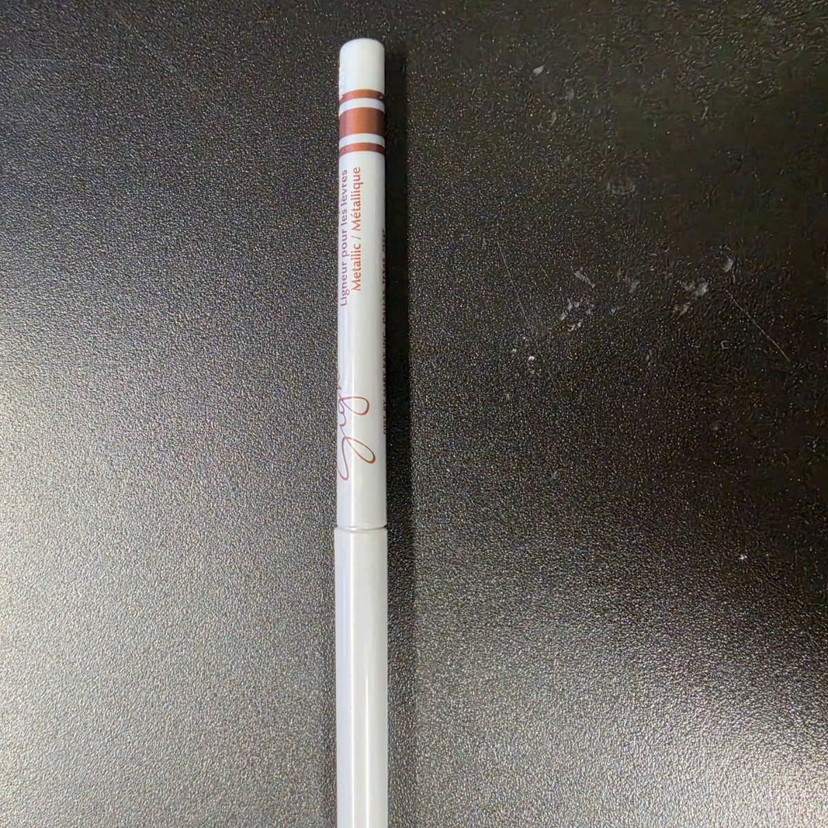 Mary Kay Signature Metallic lip liner with a white barrel and copper bands.