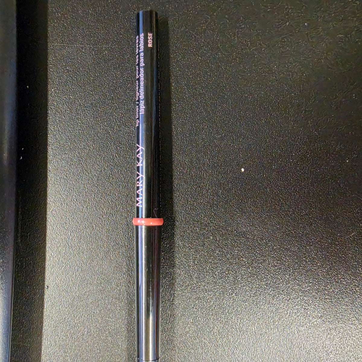 Mary Kay Rose lip liner with a black barrel, front view.