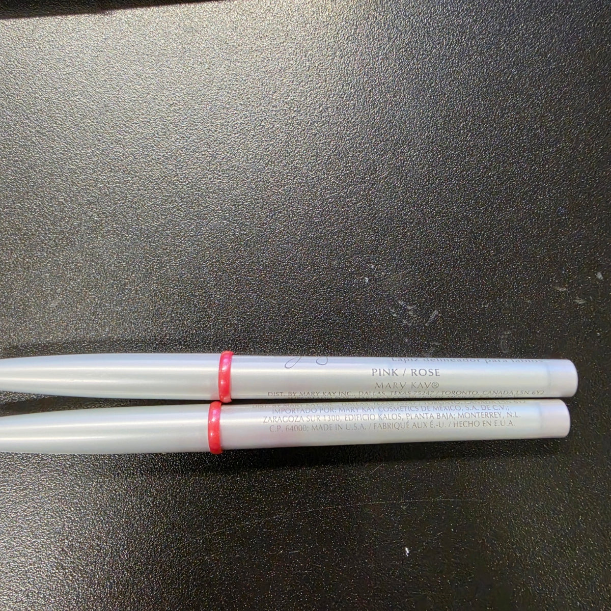 Mary Kay Signature Pink lip liners with silver barrels, front view.