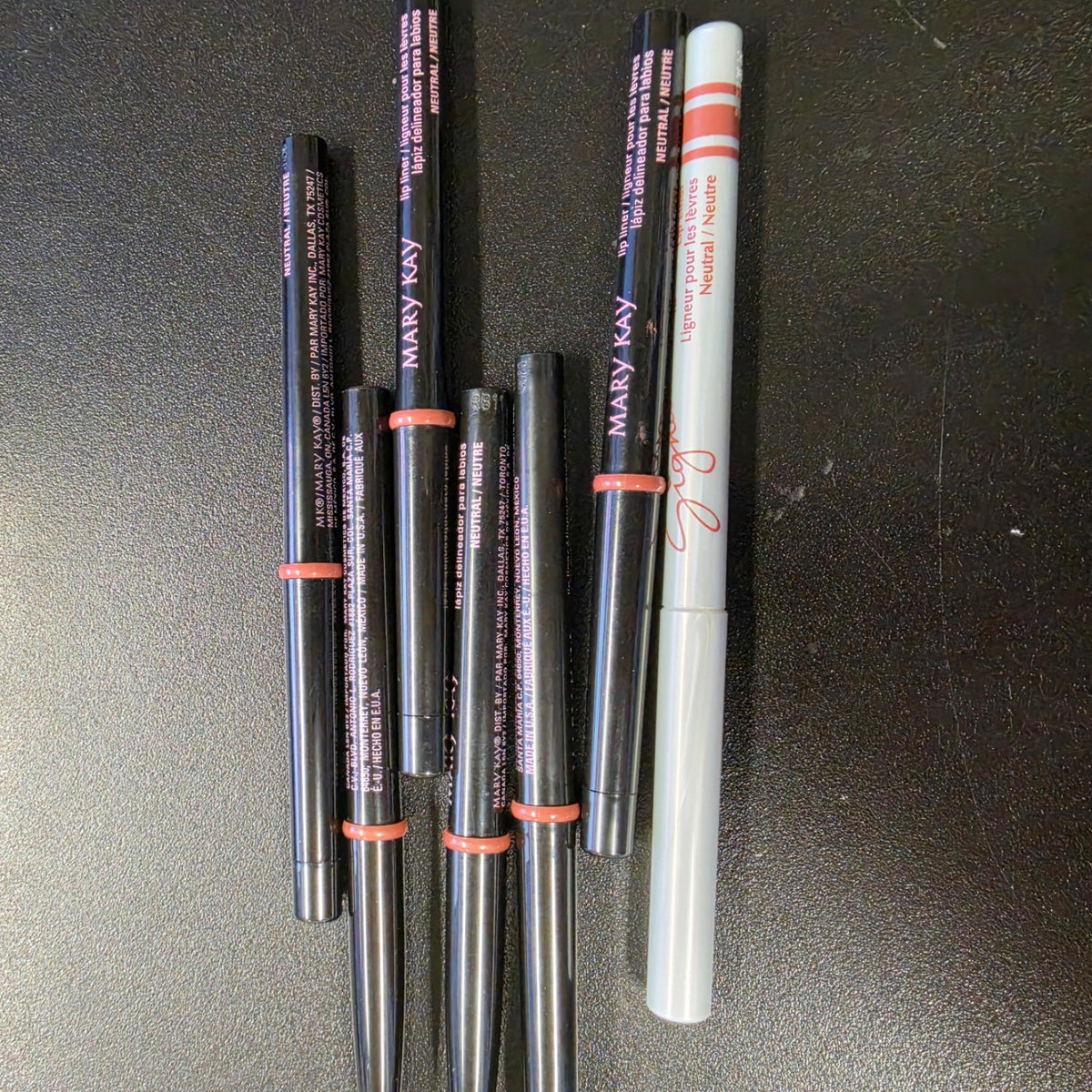 Mary Kay Neutral lip liners in black and white barrel editions.