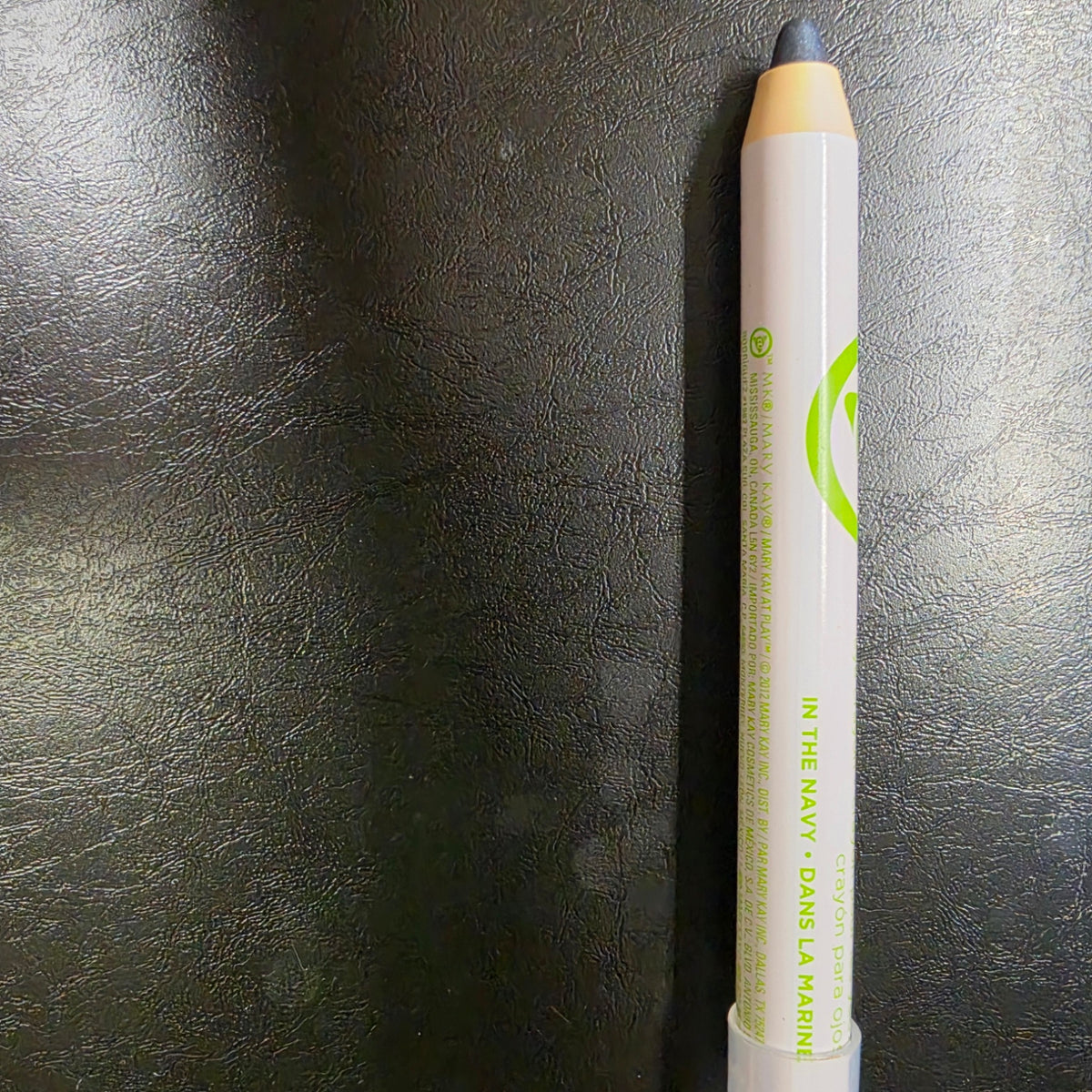 Mary Kay At Play In the Navy eye crayon with its dark blue tip exposed.