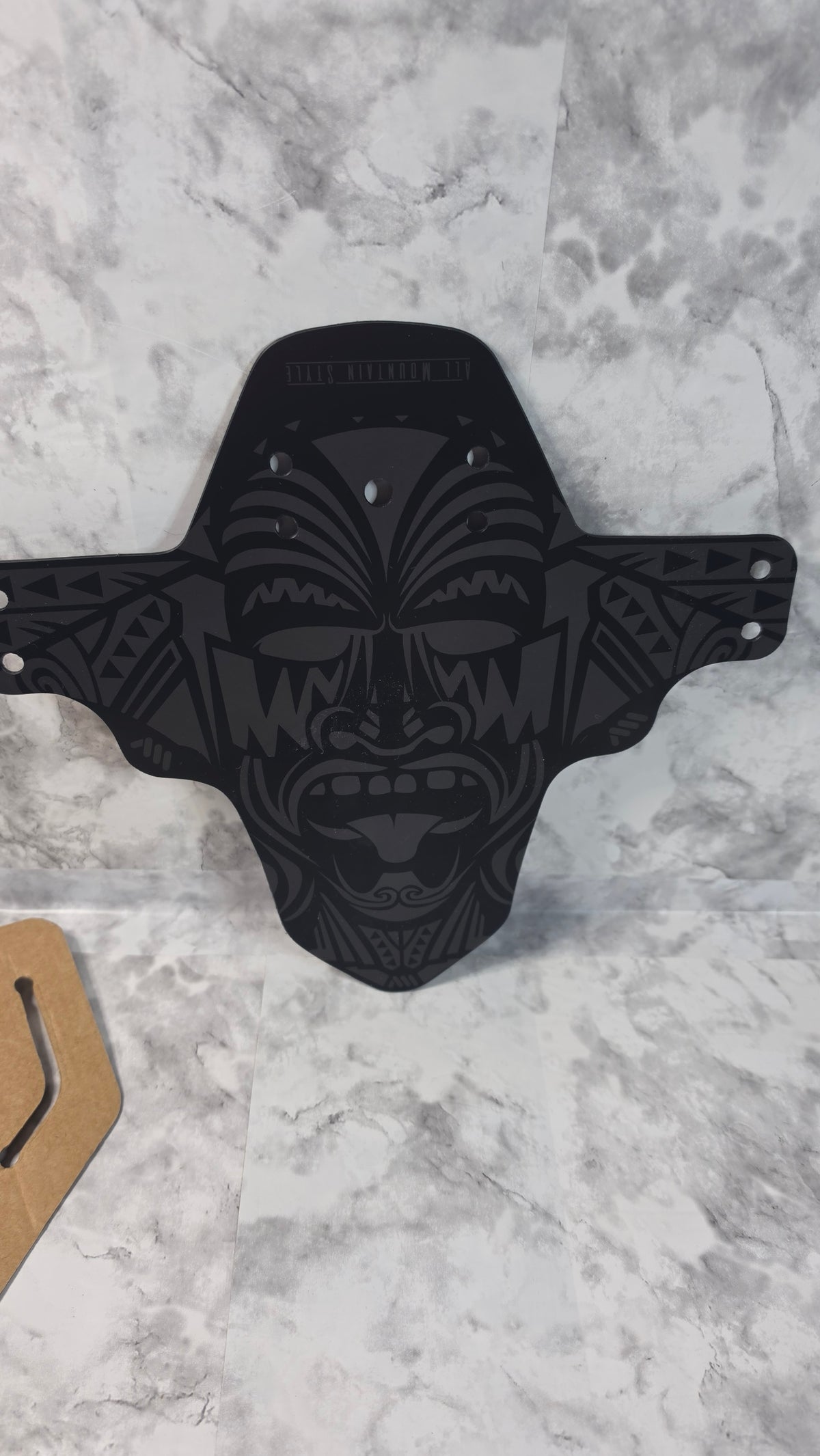 Actual stocked All Mountain Style AMS MudGuard front bike fender in Maori pattern on retail card