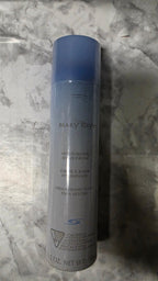 A single cylindrical bottle of Mary Kay Cell-A-Blast Hydrating Moisturizer with a blue-to-clear gradient design, standing upright on a gray marble-patterned surface.