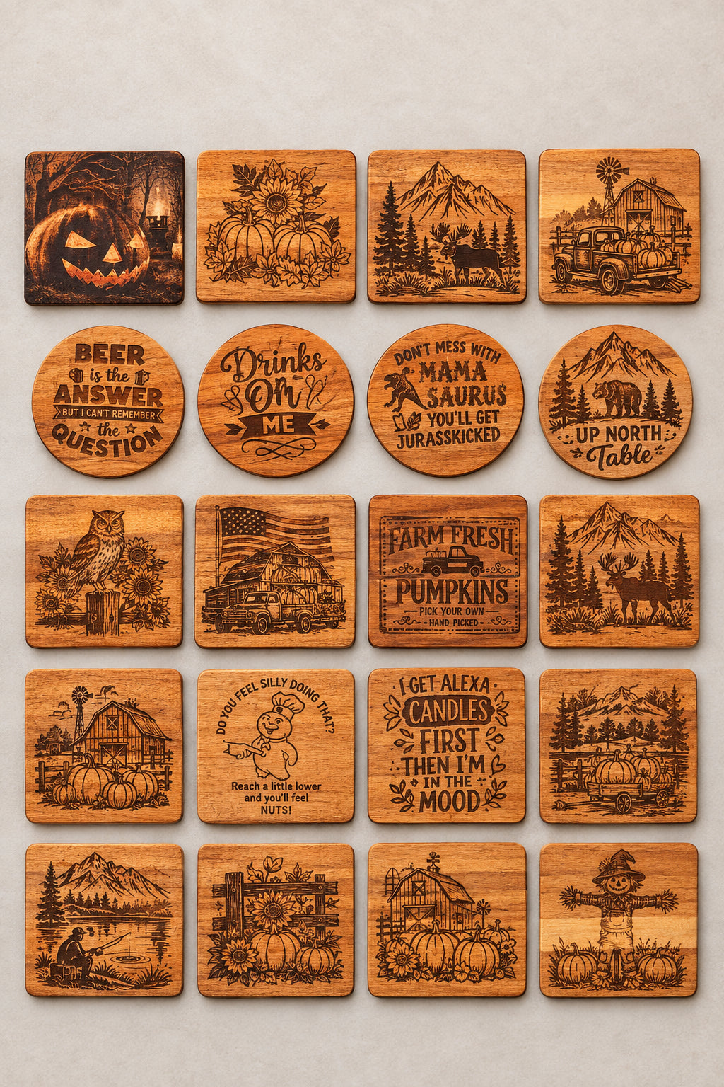 A display of various Halloween-themed engraved wooden coasters, signs, and wall art arranged on a table, with a person's legs visible at the bottom edge.