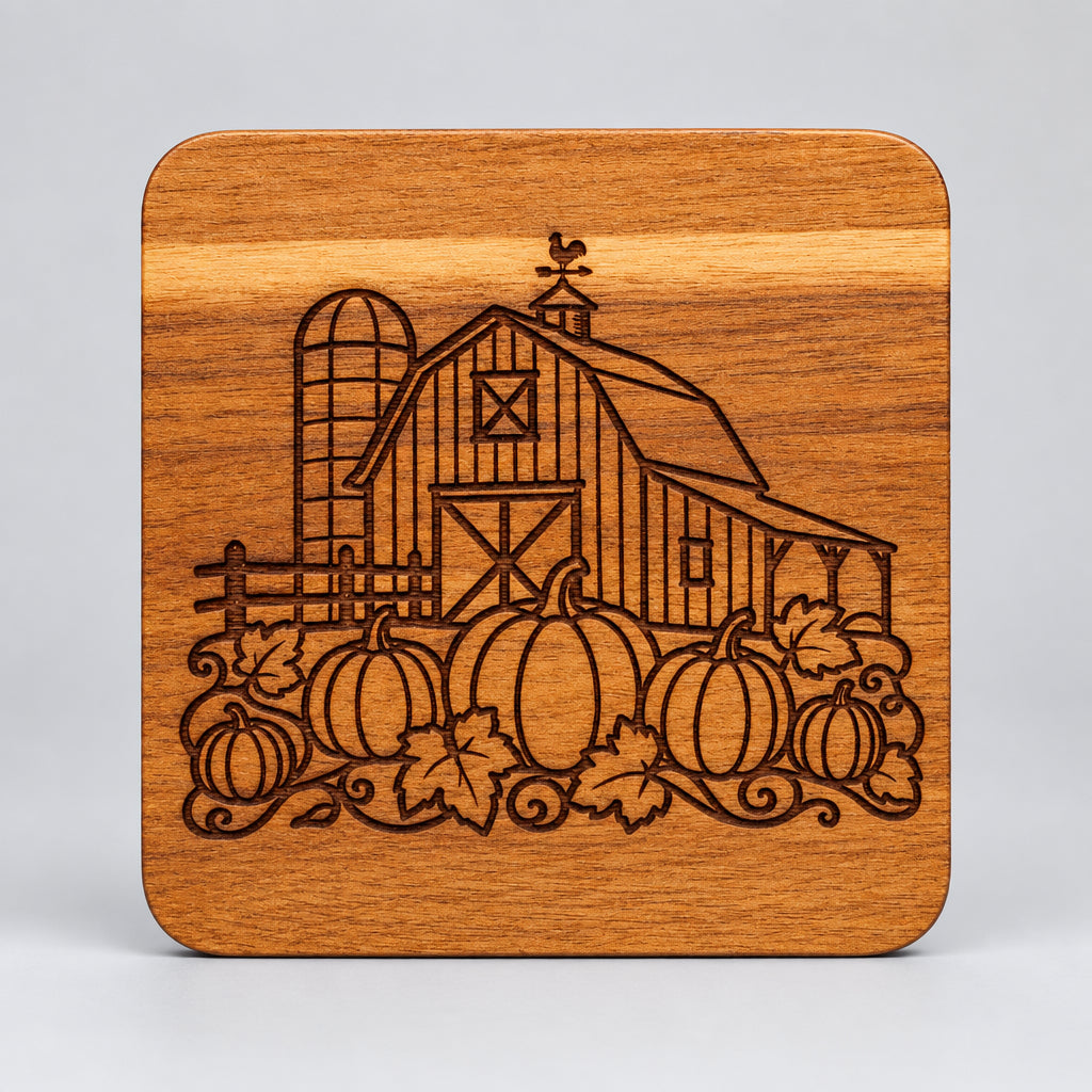 Square wood coaster with a barn, silo and pumpkins engraving