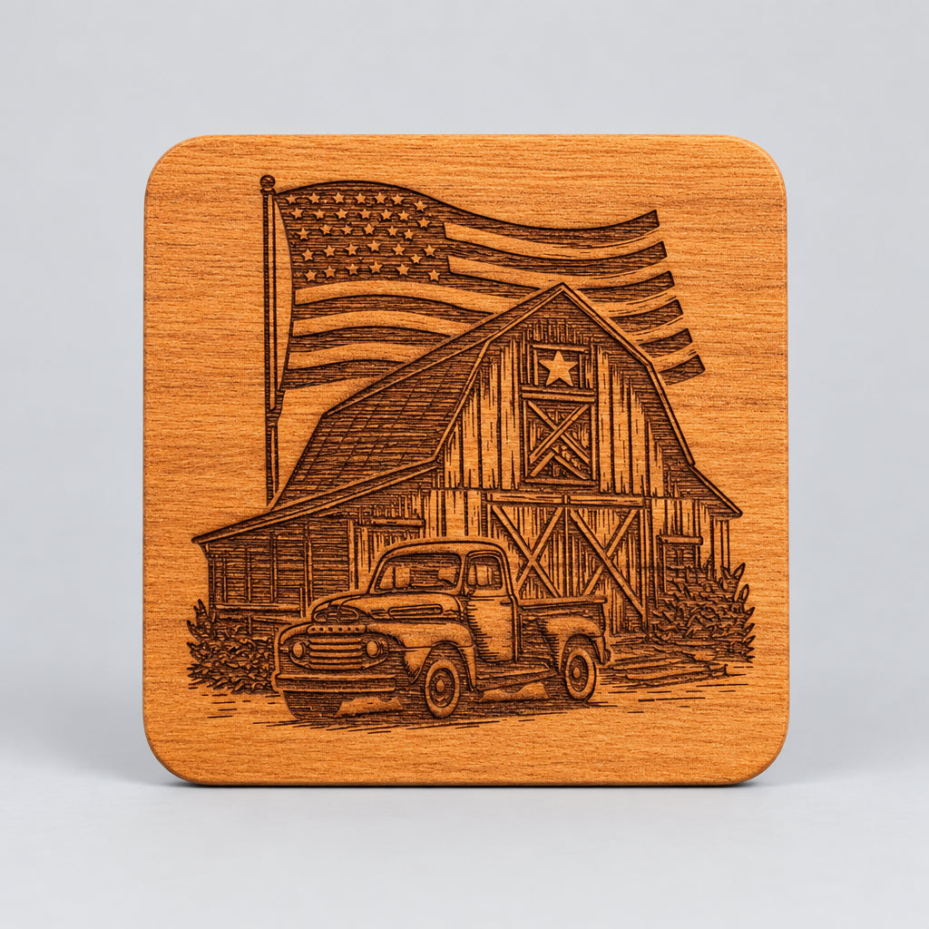 A square wooden coaster held in hands, featuring a laser-engraved design of a vintage pickup truck, a barn with an American flag, and a star on the barn door.