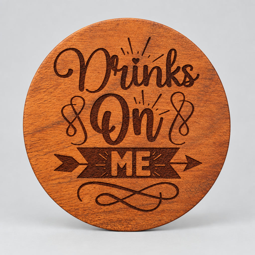 Round wood coaster with Drinks On Me lettering