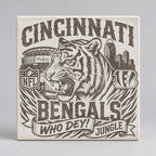 A square Cincinnati Bengals graphic print featuring a large roaring tiger, stadium, skyline, NFL shield, and the text 'CINCINNATI BENGALS WHO DEY! JUNGLE' in black on a white background.
