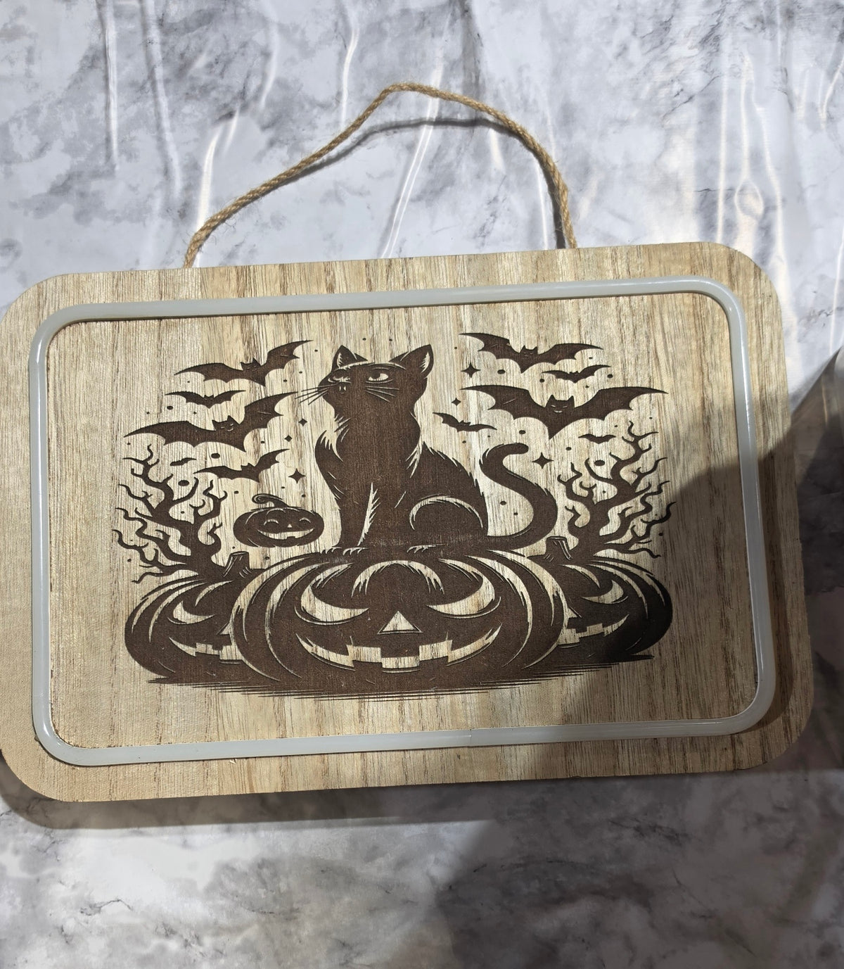 Actual Black Cat and Pumpkins laser-engraved LED hanging plaque.