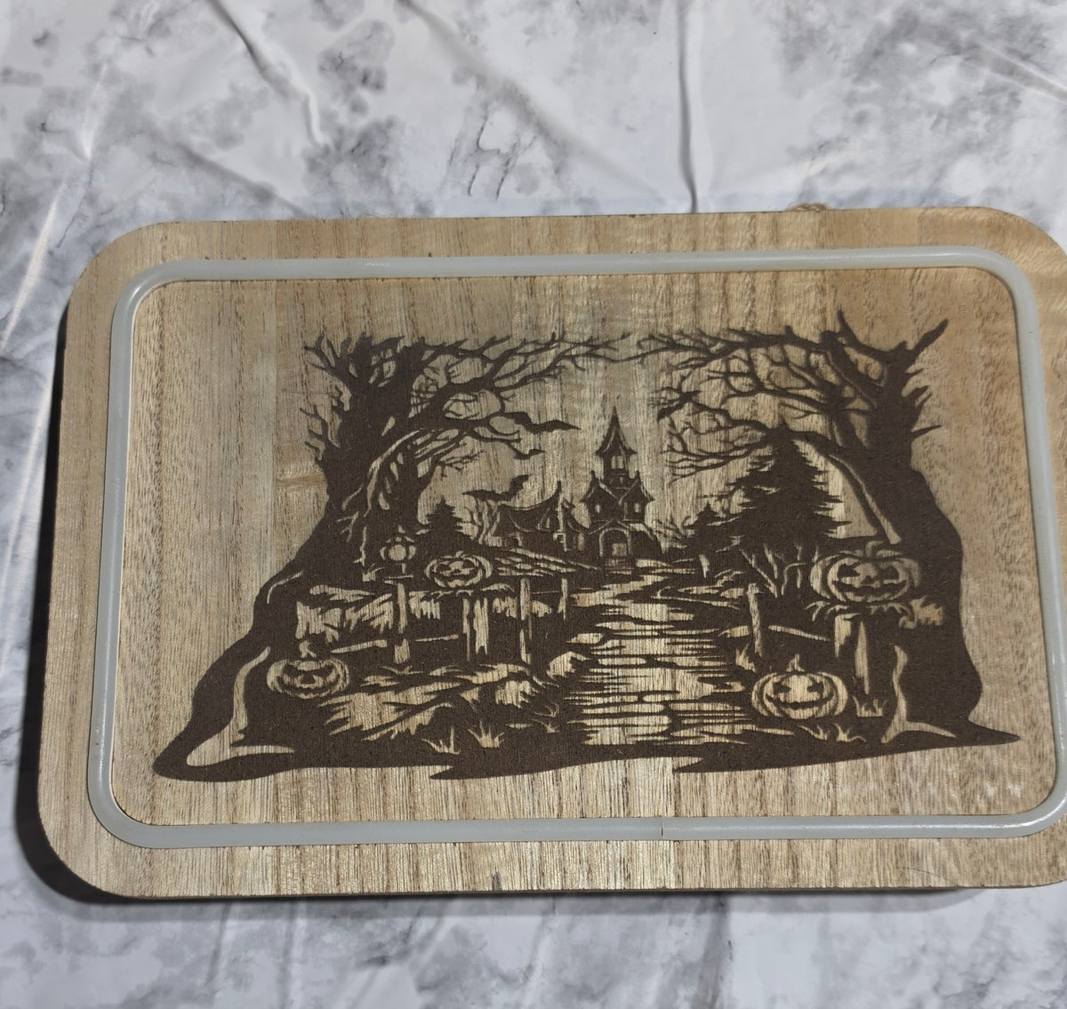 Actual Haunted Castle laser-engraved LED hanging plaque.