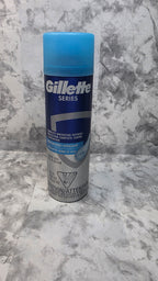 Front of a Gillette Series Moisturizing shave gel can with a blue cap, 7 oz