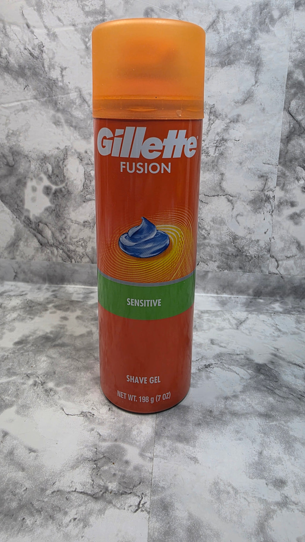 Front of an orange Gillette Fusion Sensitive shave gel can, 7 oz