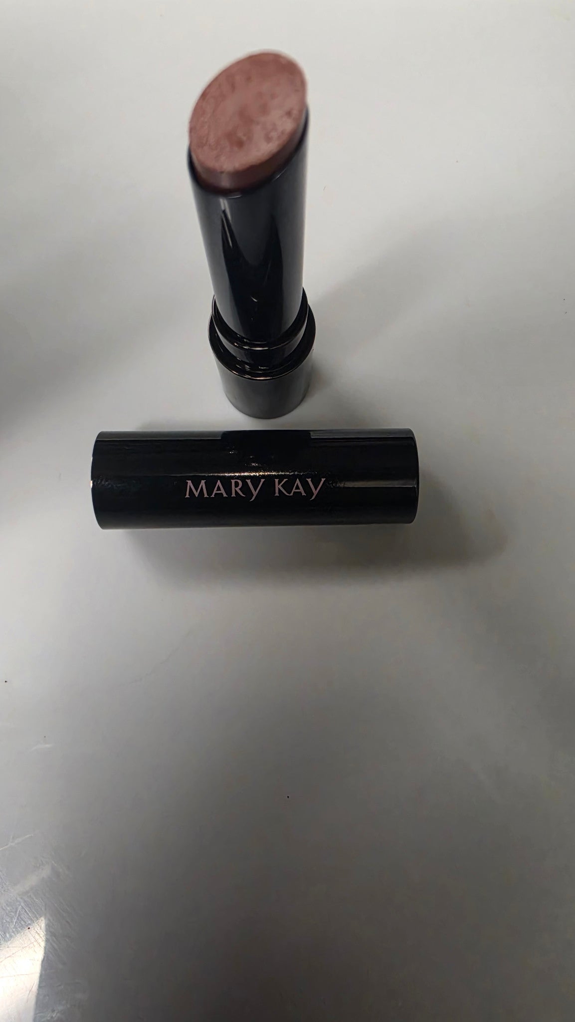 Mary Kay Better Than Bare lipstick with the cap beside it