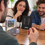 Illustrated adults playing Chainlink, with one reader holding the word-chain answer card.