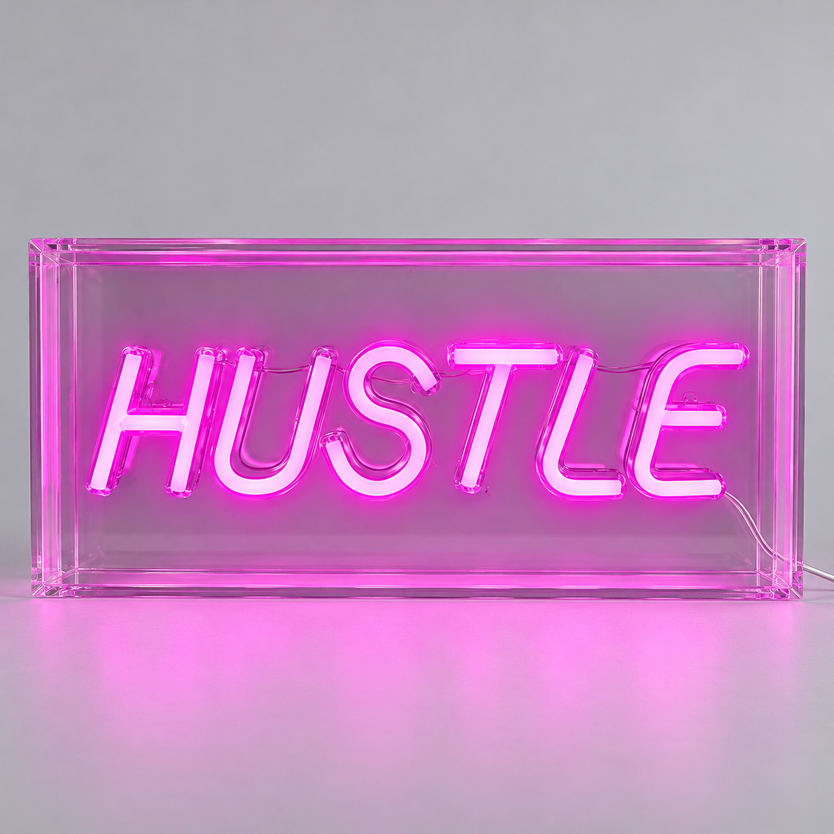 Elements HUSTLE pink LED neon sign with a clear rectangular body