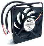 GE refrigerator condenser fan assembly showing the black fan housing, motor label and wire connector