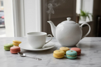 Bernardaud Organza tea saucer French afternoon tea setting with teacup and macarons lifestyle