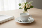 Bernardaud Organza tea saucer on elegant breakfast table setting lifestyle