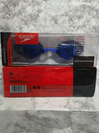 Blue swim goggles in Speedo packaging on a marble surface