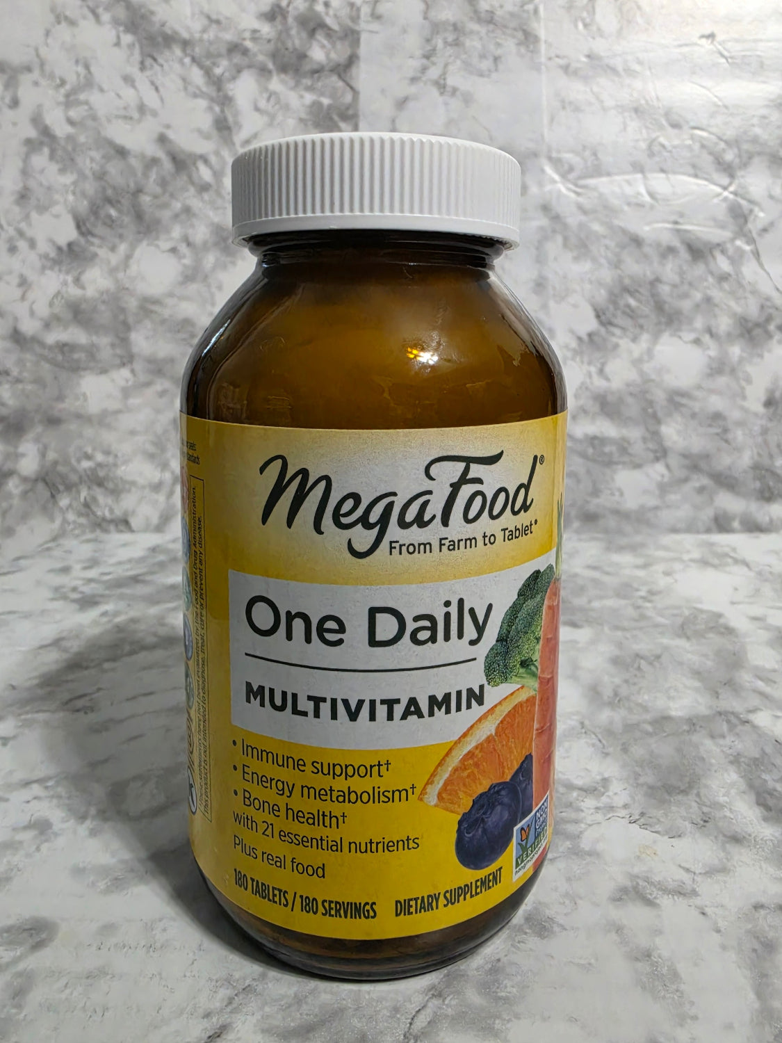Bottle of MegaFood One Daily Multivitamin on a marble surface