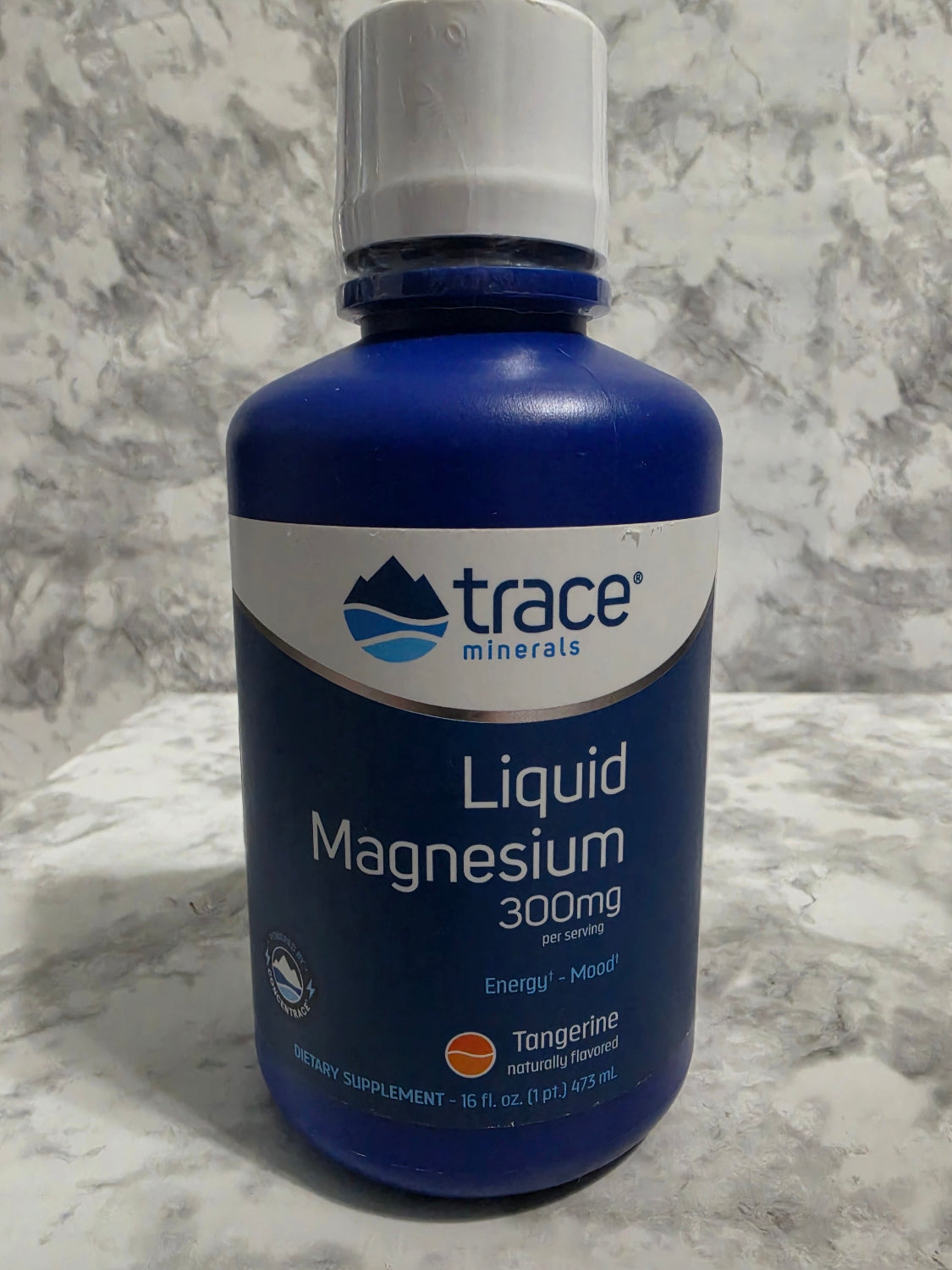 Bottle of Trace Minerals Liquid Magnesium on a marble surface