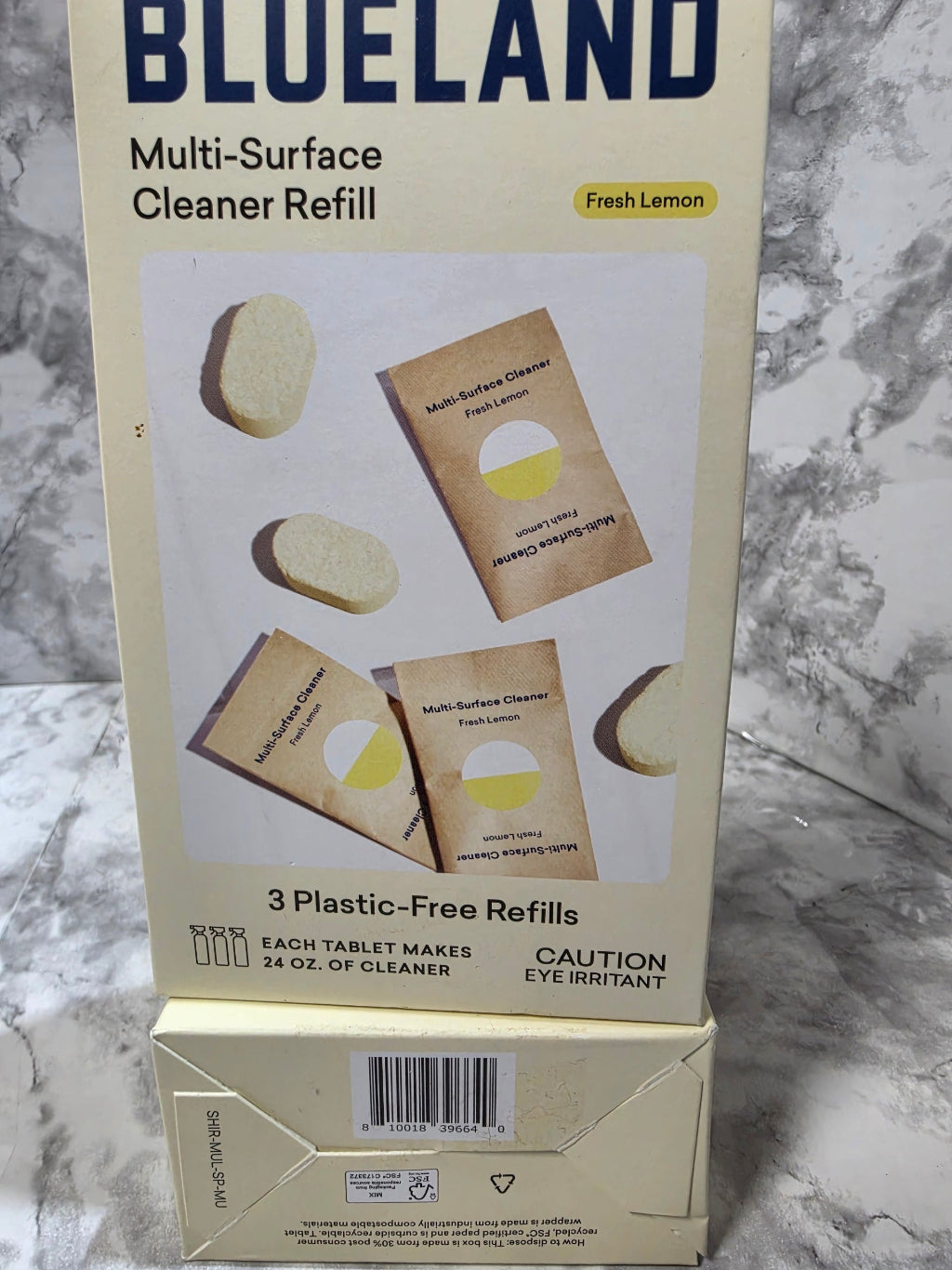 Box of Blue Land multi-surface cleaner refills on a marble surface