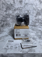 Box with a black component on a gray marble surface