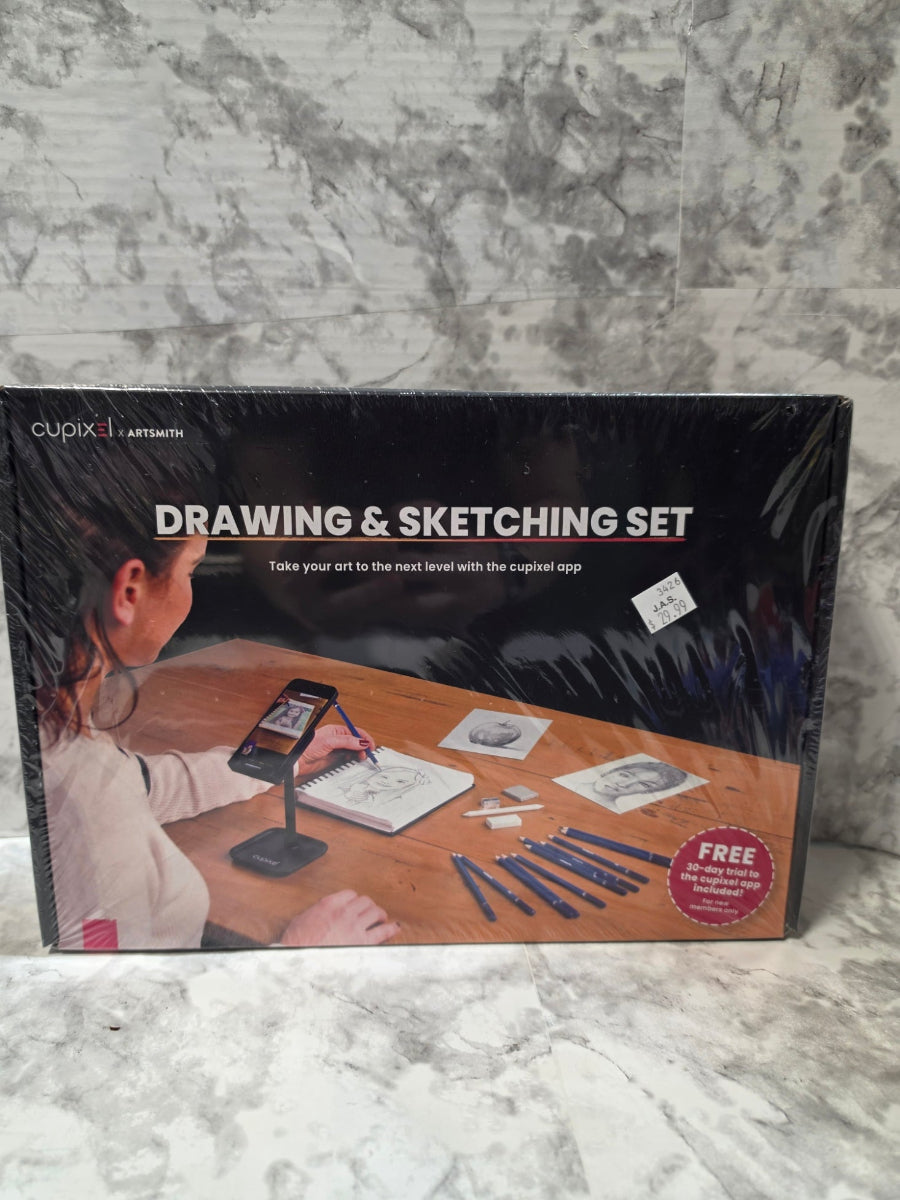 Boxed drawing and sketching set on a marble surface