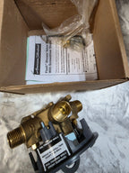 Brass valve and packaging with instructions on a textured surface